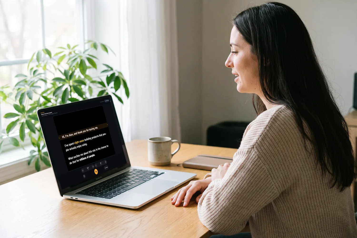 A woman at her desk rehearsing out loud, reading her script from the EasyPrompter practice page on a laptop.